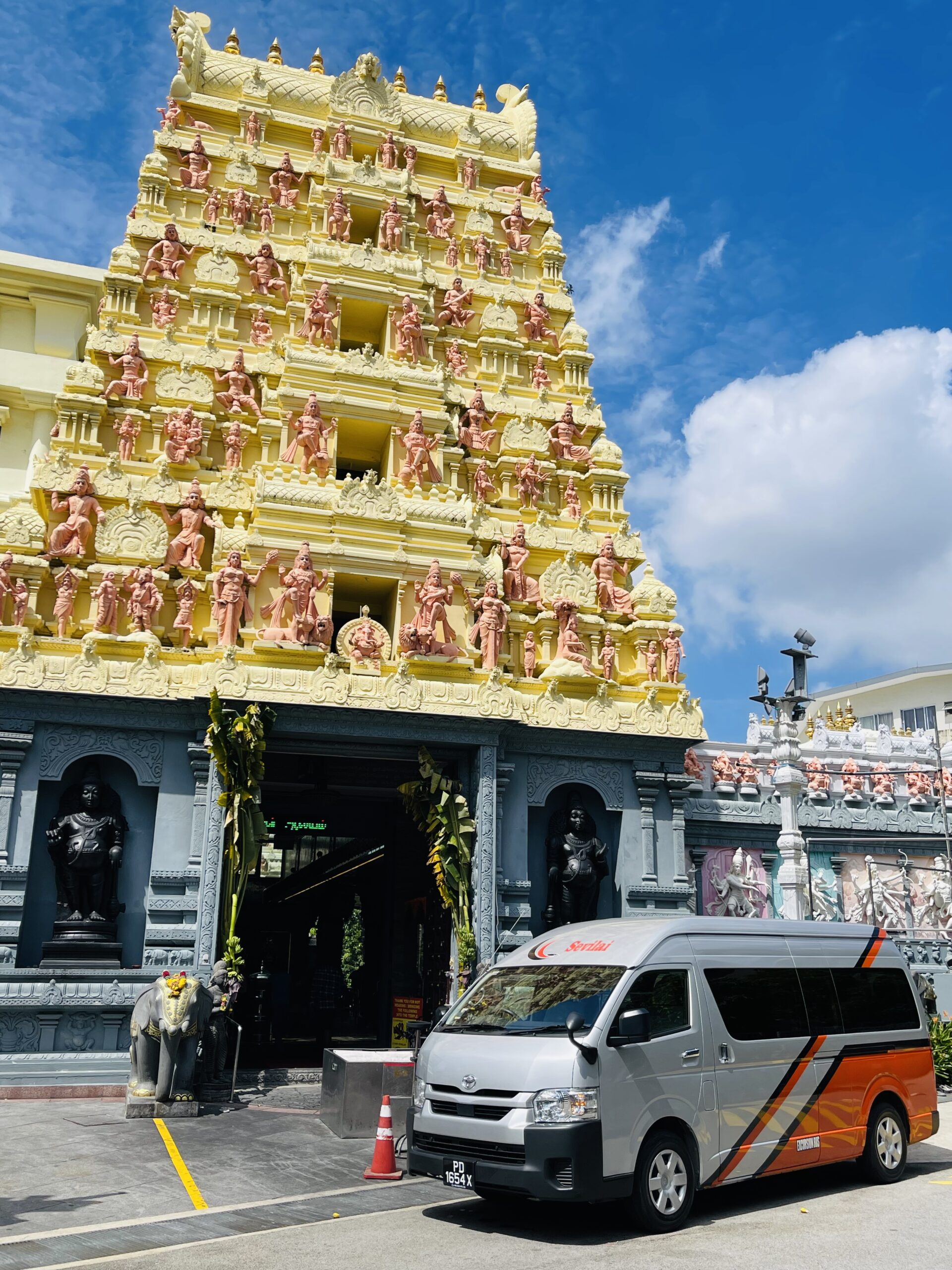 Sevilai Transport vehicles, team, and services in operation for group travel solutions.
