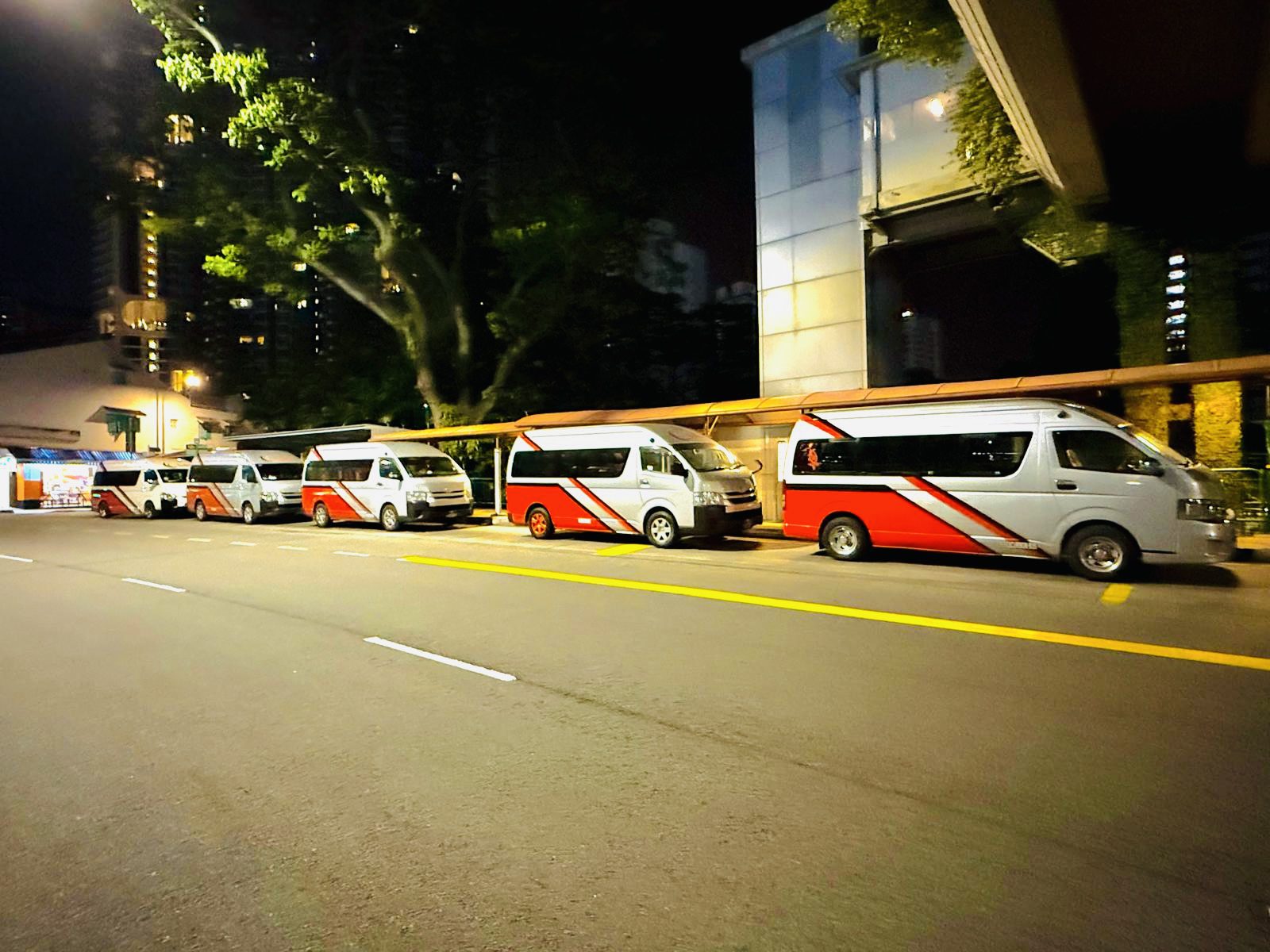 Sevilai Transport vehicles, team, and services in operation for group travel solutions.