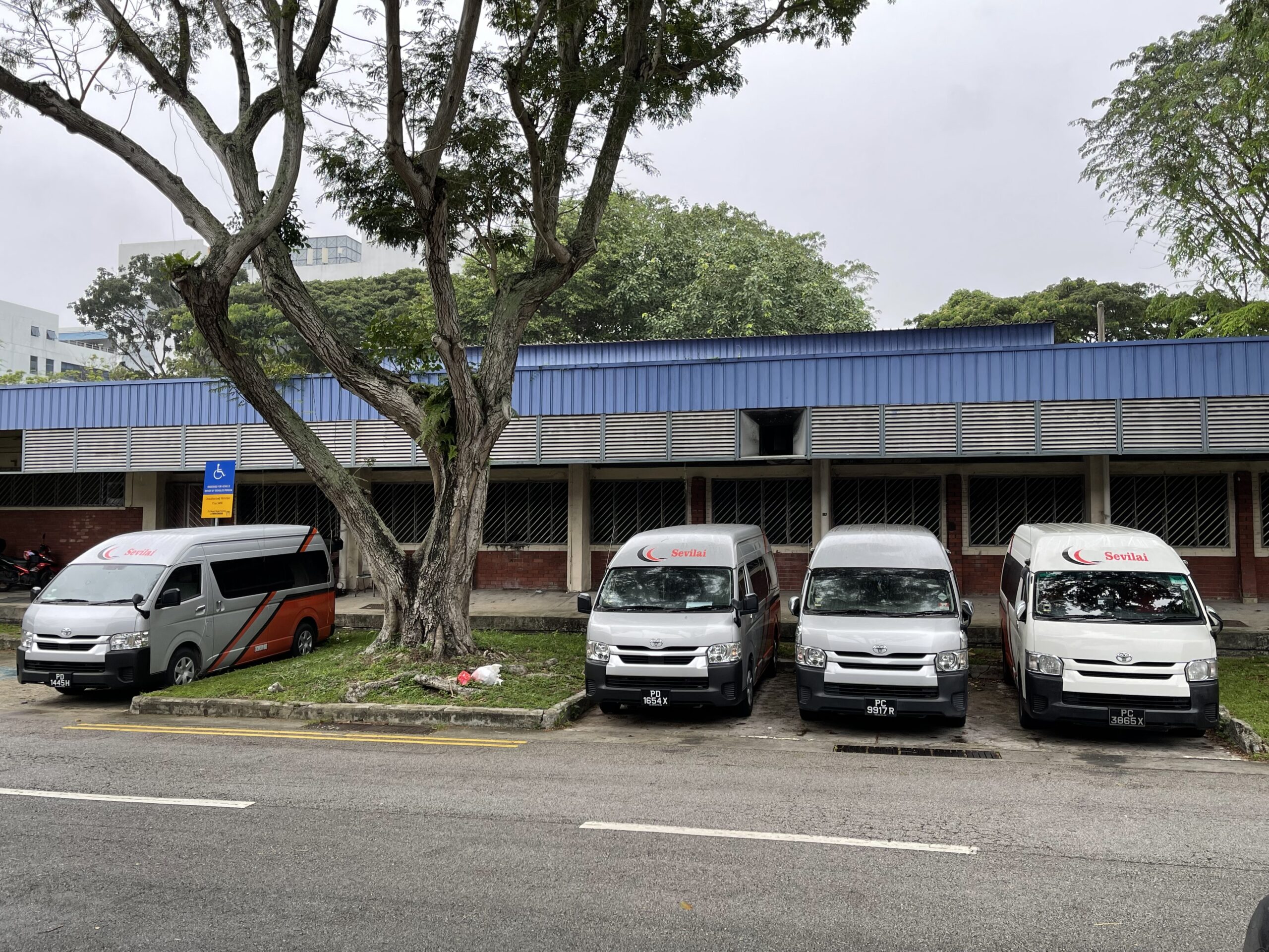 Sevilai Transport vehicles, team, and services in operation for group travel solutions.