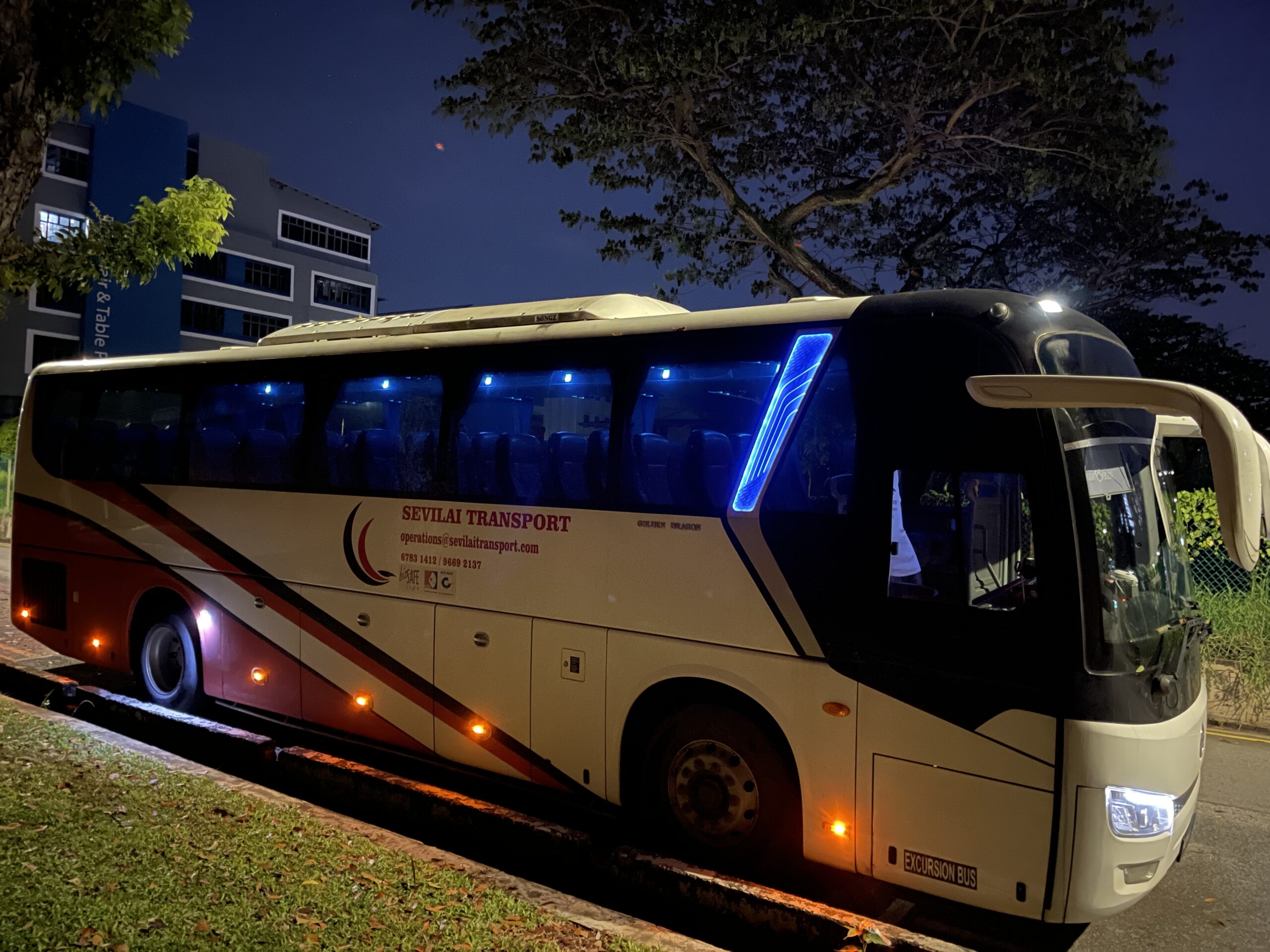 Sevilai Transport team and fleet representing the company’s journey and growth in group travel services.
