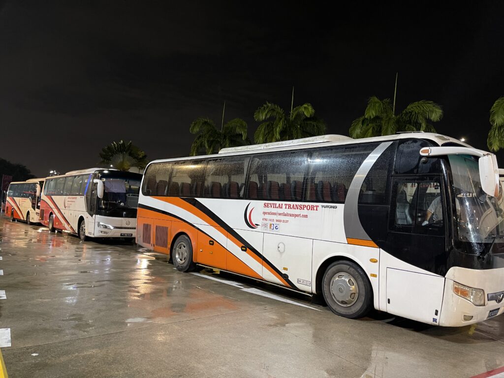 Sevilai Transport vehicles, team, and services in operation for group travel solutions.