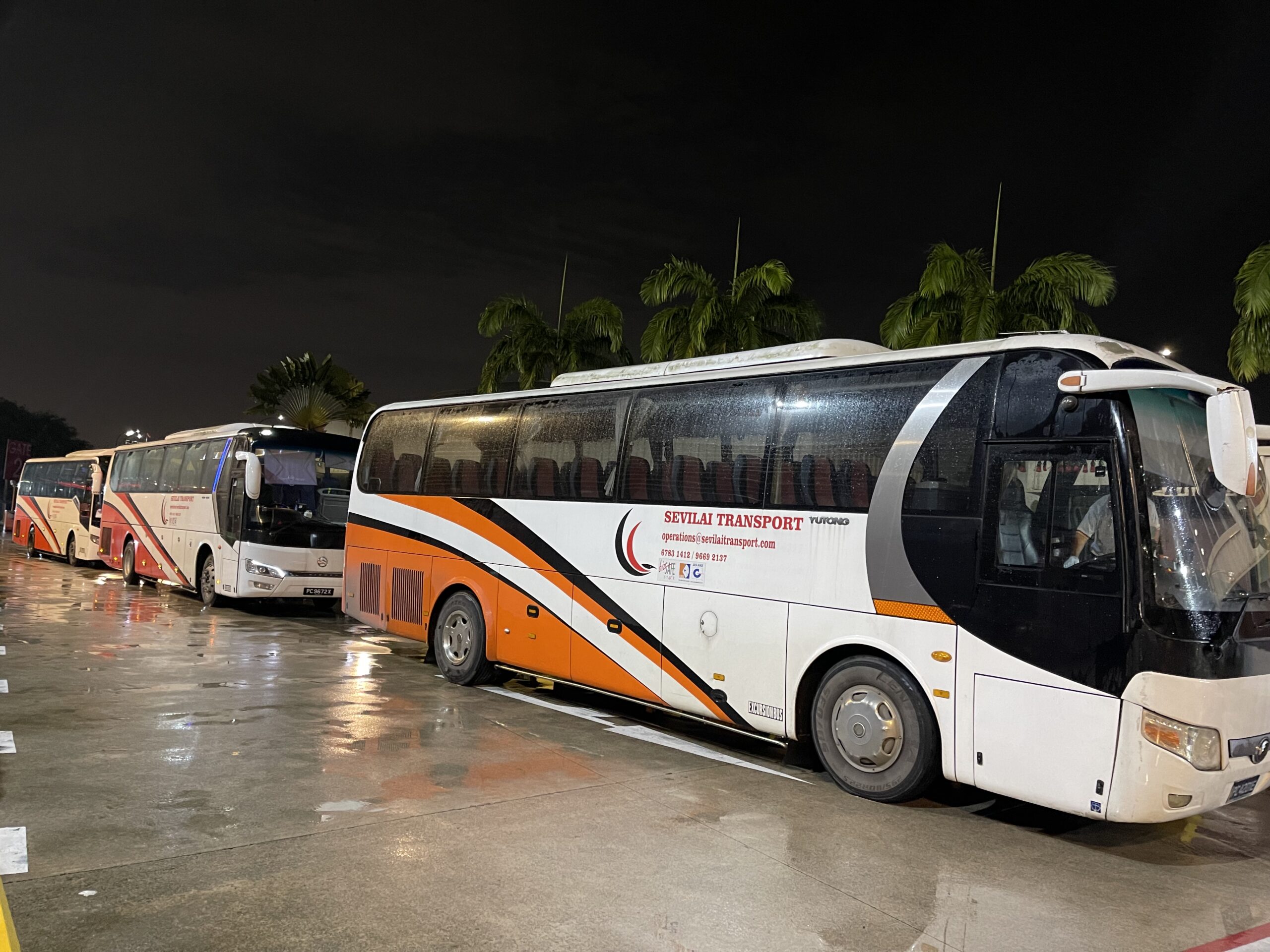 Sevilai Transport vehicles, team, and services in operation for group travel solutions.