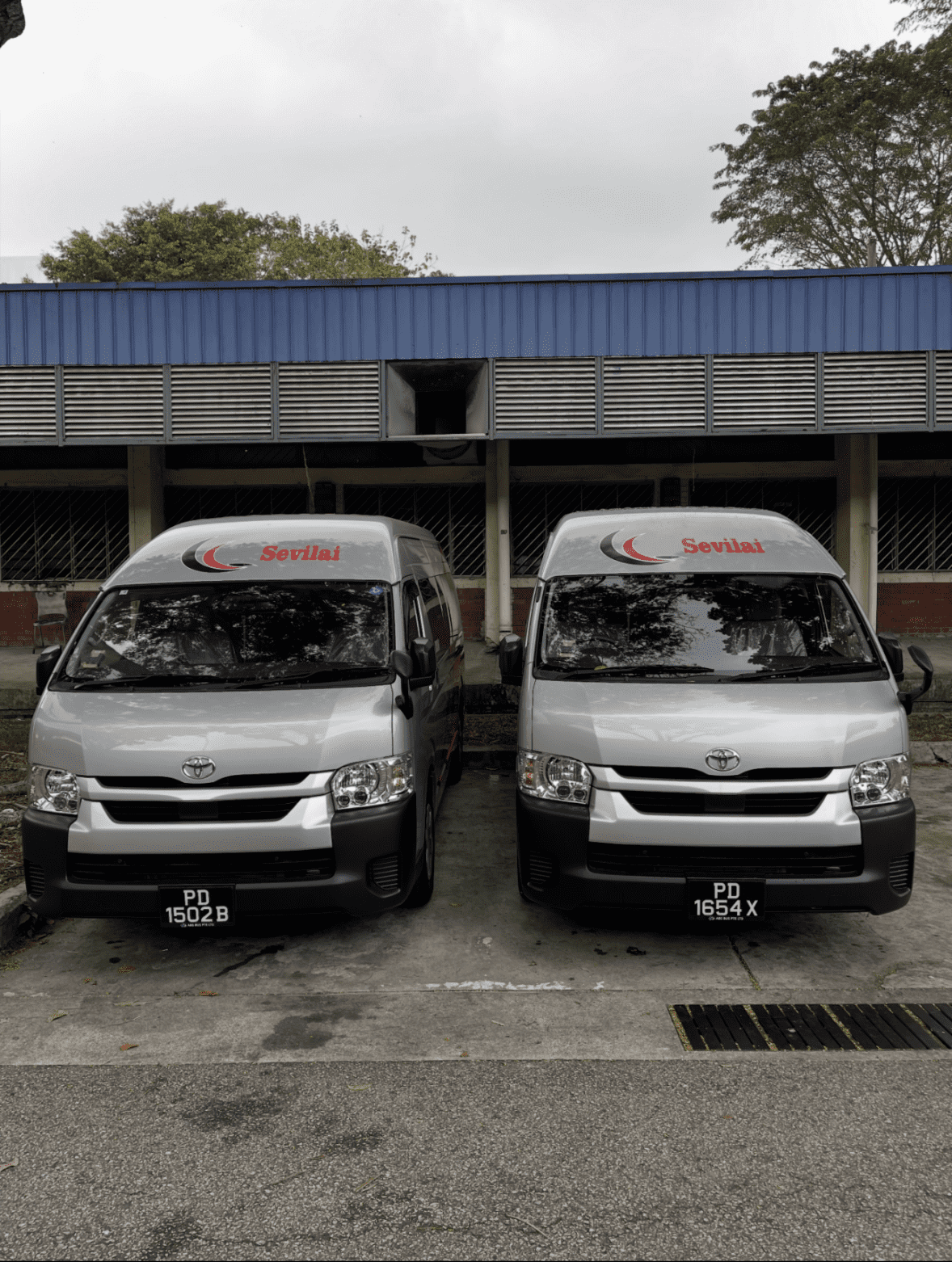 Sevilai Transport vehicles, team, and services in operation for group travel solutions.